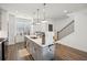 Kitchen with island, stainless steel appliances, and pendant lighting at 3130 Bennett Creek Ln, Suwanee, GA 30024