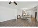 Bright living and dining area featuring hardwood floors and views into a modern kitchen at 3130 Bennett Creek Ln, Suwanee, GA 30024