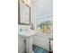 Charming powder room with pedestal sink and natural light at 3130 Bennett Creek Ln, Suwanee, GA 30024