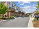 View of the modern townhome community featuring well-maintained landscaping and attached garages at 3130 Bennett Creek Ln, Suwanee, GA 30024