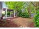 Lovely backyard features a patio, pergola, shade trees, lush landscaping and plenty of privacy at 3911 Delfaire Trce, Cumming, GA 30040