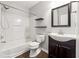 Bathroom features shower/tub combo, dark wood vanity, and a modern sink at 3911 Delfaire Trce, Cumming, GA 30040
