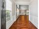 Inviting foyer with hardwood floors and view into living spaces at 3911 Delfaire Trce, Cumming, GA 30040