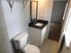 Stylishly updated bathroom features a black-veined countertop and modern fixtures at 464 Mephisto Cir, Lawrenceville, GA 30046