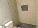 Contemporary bathroom with tiled shower, niche and patterned tile floor at 464 Mephisto Cir, Lawrenceville, GA 30046