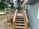 Exterior staircase leads to wooden deck with railings at 464 Mephisto Cir, Lawrenceville, GA 30046