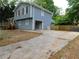 Two-story home with an attached garage and a concrete driveway at 464 Mephisto Cir, Lawrenceville, GA 30046