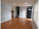 Inviting living room with laminate flooring, staircase, and access to other rooms at 464 Mephisto Cir, Lawrenceville, GA 30046
