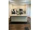 A kitchen featuring stainless steel appliances, an island with granite countertops, and dark wood flooring at 6905 Rogers Pt, Lithonia, GA 30058