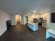 Inviting open living space with wood flooring, island kitchen and modern finishes at 6905 Rogers Pt, Lithonia, GA 30058