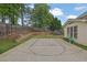 This backyard has a basketball court, patio and lawn space at 92 Creek Front Way, Lawrenceville, GA 30043