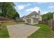 The backyard features a basketball court, patio area, and is completely fenced in at 92 Creek Front Way, Lawrenceville, GA 30043