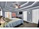 Main bedroom with trey ceiling, comfortable furnishings and ensuite bathroom access at 92 Creek Front Way, Lawrenceville, GA 30043