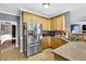 Fully equipped kitchen with stainless steel appliances and generous countertop space at 92 Creek Front Way, Lawrenceville, GA 30043