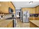 Well-equipped kitchen featuring stainless steel appliances, tile backsplash, and granite countertops at 92 Creek Front Way, Lawrenceville, GA 30043