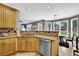 Open kitchen with a breakfast bar, stainless steel appliances, and seamless flow to the dining area at 92 Creek Front Way, Lawrenceville, GA 30043