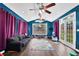 Spacious living room with vaulted ceilings, many windows, hardwood floors, and backyard access at 92 Creek Front Way, Lawrenceville, GA 30043