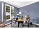 Home office featuring a large window and a modern desk with a comfortable chair at 92 Creek Front Way, Lawrenceville, GA 30043
