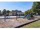 Community playground includes a slide, swings, and nearby pool area for Gathering enjoyment at 92 Creek Front Way, Lawrenceville, GA 30043