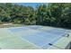 Community tennis courts offer ample play area for a competitive match or casual recreation at 92 Creek Front Way, Lawrenceville, GA 30043
