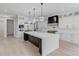 Spacious kitchen featuring an oversized island, stainless appliances, and custom cabinetry at 2728 Talley Ln, Buford, GA 30519