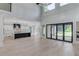 Bright, open-concept living space with hardwood floors and access to kitchen and outdoor space at 2728 Talley Ln, Buford, GA 30519