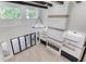 High-ceiling living room with wooden beams, fireplace, and expansive windows for ample natural light at 2728 Talley Ln, Buford, GA 30519