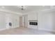 Bright main bedroom featuring hardwood floors, modern fireplace and tray ceiling with contemporary light fixture at 2728 Talley Ln, Buford, GA 30519