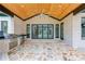 Outdoor kitchen and patio with stone flooring, ceiling fan, and built-in grill area at 2728 Talley Ln, Buford, GA 30519