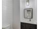 Modern powder room with vanity, shiplap, and statement mirror and lighting at 2728 Talley Ln, Buford, GA 30519