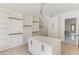 Walk-in closet featuring custom shelving and center island with storage cabinets at 2728 Talley Ln, Buford, GA 30519