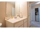 Bathroom sink and vanity feature a mirror, paper towels, and room for toiletries at 7105 Boulder Pass, Union City, GA 30291