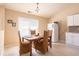 Cozy dining area with vaulted ceilings, a window and comfortable furniture at 7105 Boulder Pass, Union City, GA 30291