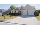 Charming single-Gathering home with a brick and tan exterior, well-manicured lawn, and a two-car garage at 7105 Boulder Pass, Union City, GA 30291