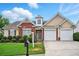 Inviting single-Gathering home with brick accents, manicured landscaping, and a two-car garage on a sunny day at 7105 Boulder Pass, Union City, GA 30291