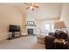 Comfortable living room featuring a fireplace, neutral carpeting, and cozy seating arrangements at 7105 Boulder Pass, Union City, GA 30291