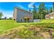 Home exterior with a large grassy backyard and wooden deck at 7474 Waterview Cv, Douglasville, GA 30135