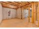 Unfinished basement with exposed framing and concrete walls at 7474 Waterview Cv, Douglasville, GA 30135