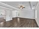 Large bedroom with tray ceilings, wood flooring, recessed lighting, and windows for natural light at 7474 Waterview Cv, Douglasville, GA 30135