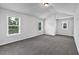 A bedroom featuring plush carpeting and multiple windows providing lots of natural light at 7474 Waterview Cv, Douglasville, GA 30135