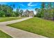 Long driveway leading up to a beautifully landscaped new construction home at 7474 Waterview Cv, Douglasville, GA 30135