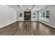 Spacious living room features a stone fireplace, coffered ceilings and ample natural light at 7474 Waterview Cv, Douglasville, GA 30135
