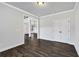 Bright office featuring hardwood floors, white walls, and a view into the hallway at 7474 Waterview Cv, Douglasville, GA 30135