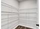 Walk-in pantry with metal shelving for organized storage of food and supplies at 7474 Waterview Cv, Douglasville, GA 30135