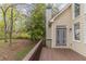 Cozy back deck area with views of the backyard surrounded by lush greenery at 1209 Fenmore Hall Dr, Powder Springs, GA 30127