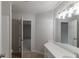 Well-lit bathroom with a spacious vanity, large mirror, and a separate toilet room at 1209 Fenmore Hall Dr, Powder Springs, GA 30127