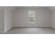 Large bedroom with ample light and neutral decor, great for relaxation or a home office at 1209 Fenmore Hall Dr, Powder Springs, GA 30127