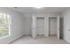 Inviting bedroom with natural light, ample closet space, and neutral carpet at 1209 Fenmore Hall Dr, Powder Springs, GA 30127