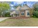 Charming two-story home featuring stone accents and a well-manicured lawn at 1209 Fenmore Hall Dr, Powder Springs, GA 30127