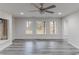 Open room with light vinyl floors and large windows, allowing ample natural light at 1209 Fenmore Hall Dr, Powder Springs, GA 30127